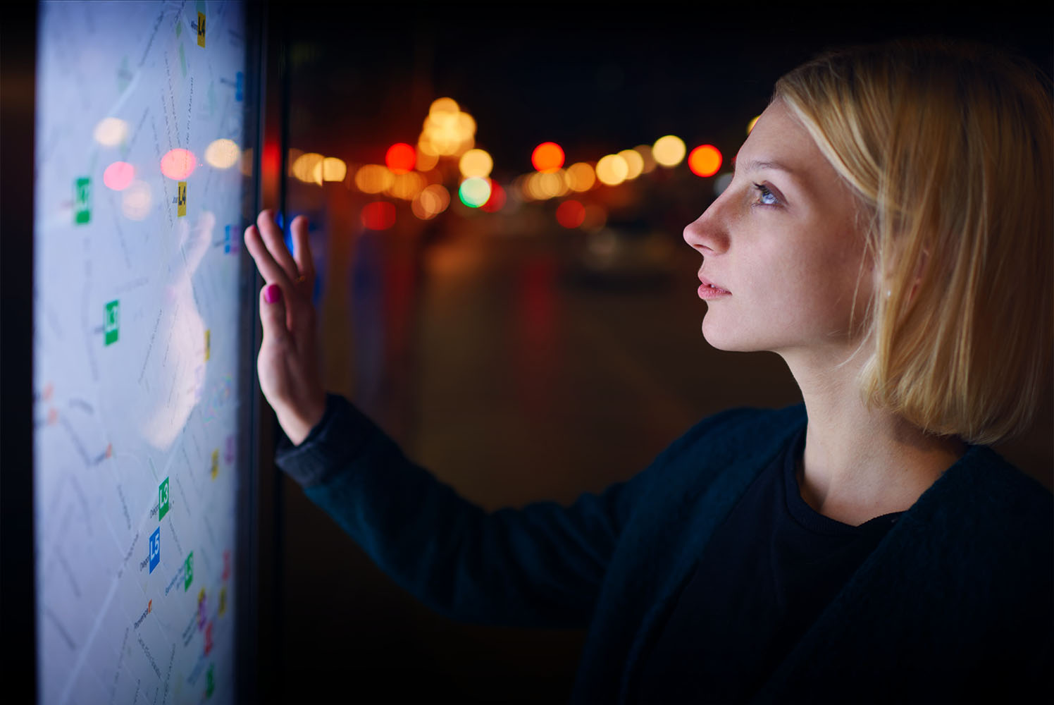 Person using digital screen of a map