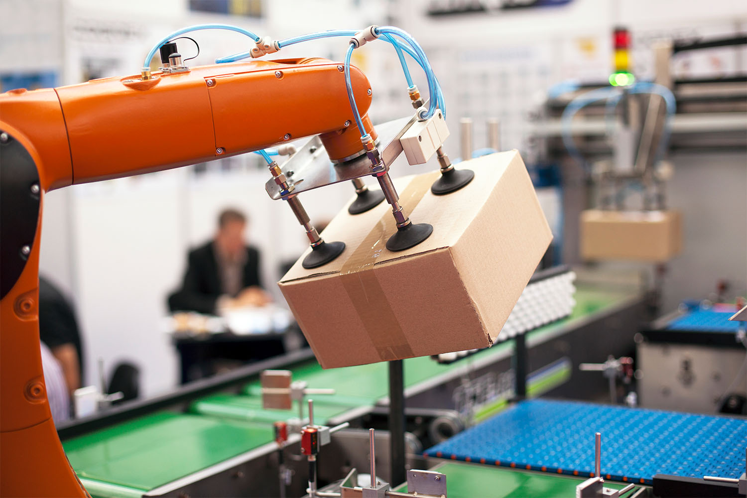 Assembly robot picking up a package