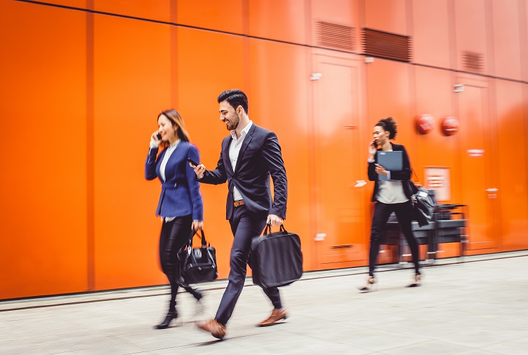 People in business clothes walking in the street