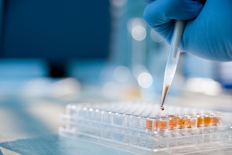 Close up of test tubes being filled