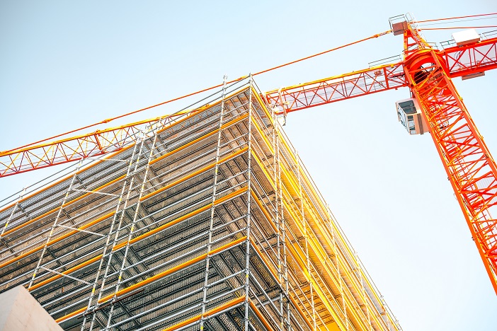 Construction building and crane