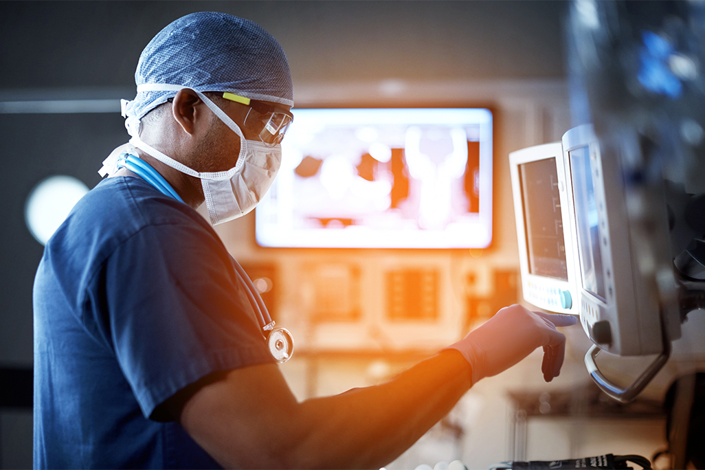 Doctor looking at an x-ray on a screen