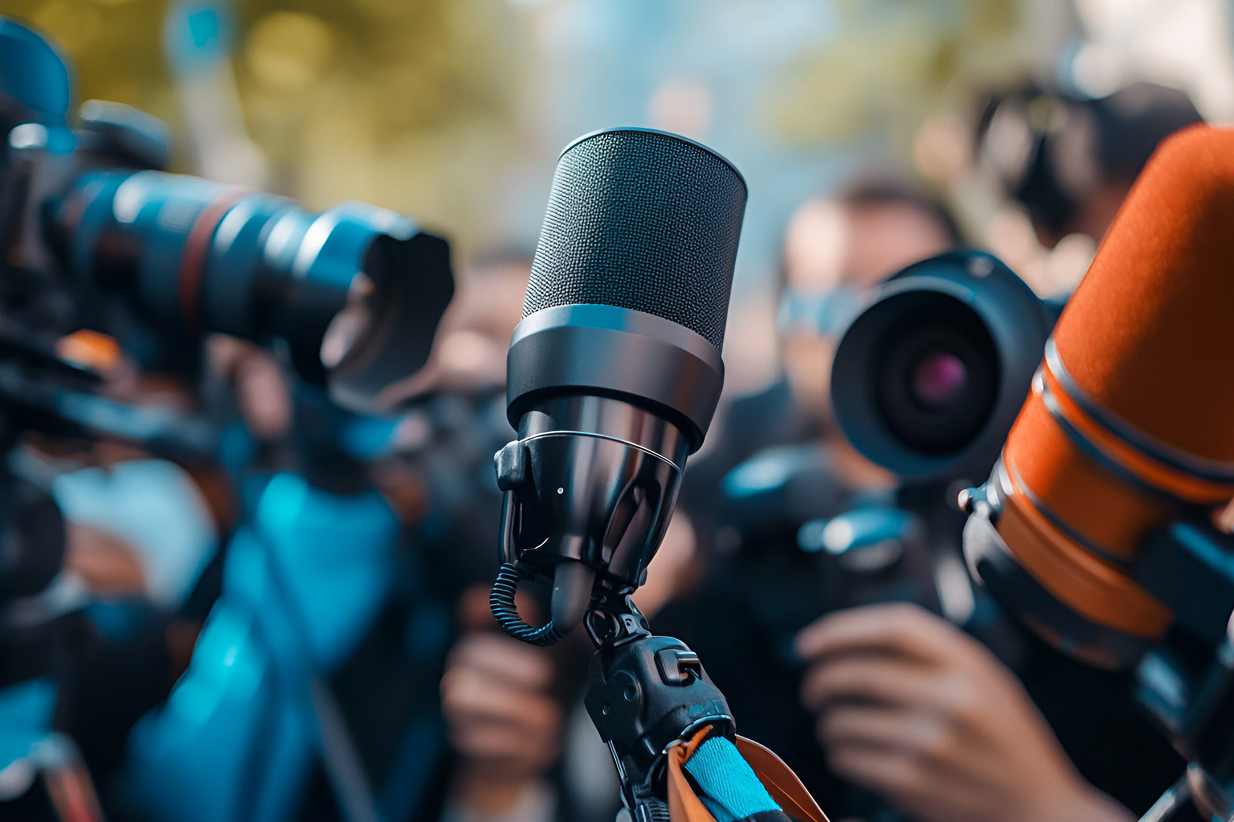 Interview microphones of a crowd of journalists