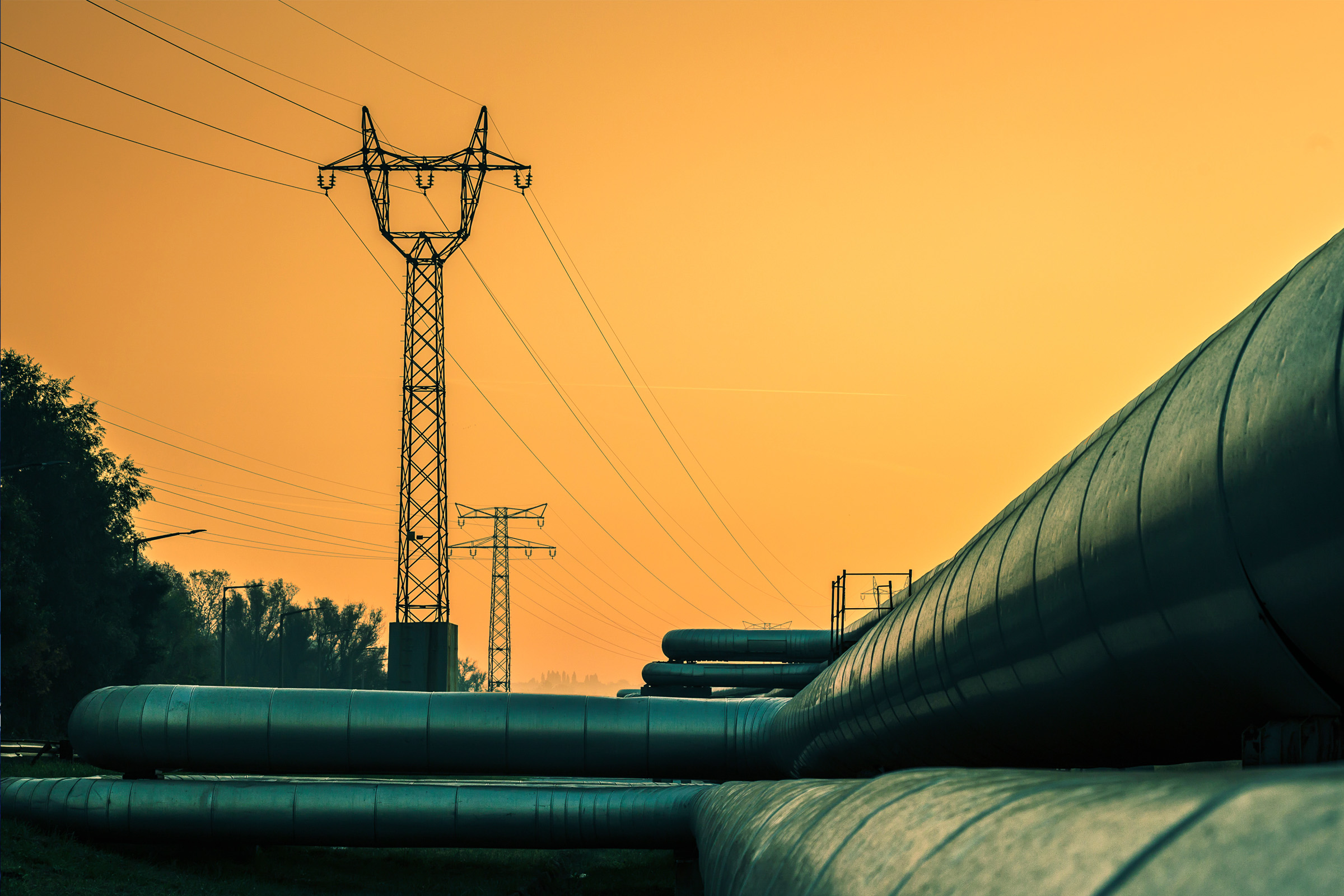 District heating tube pipes with electricity pylons behind