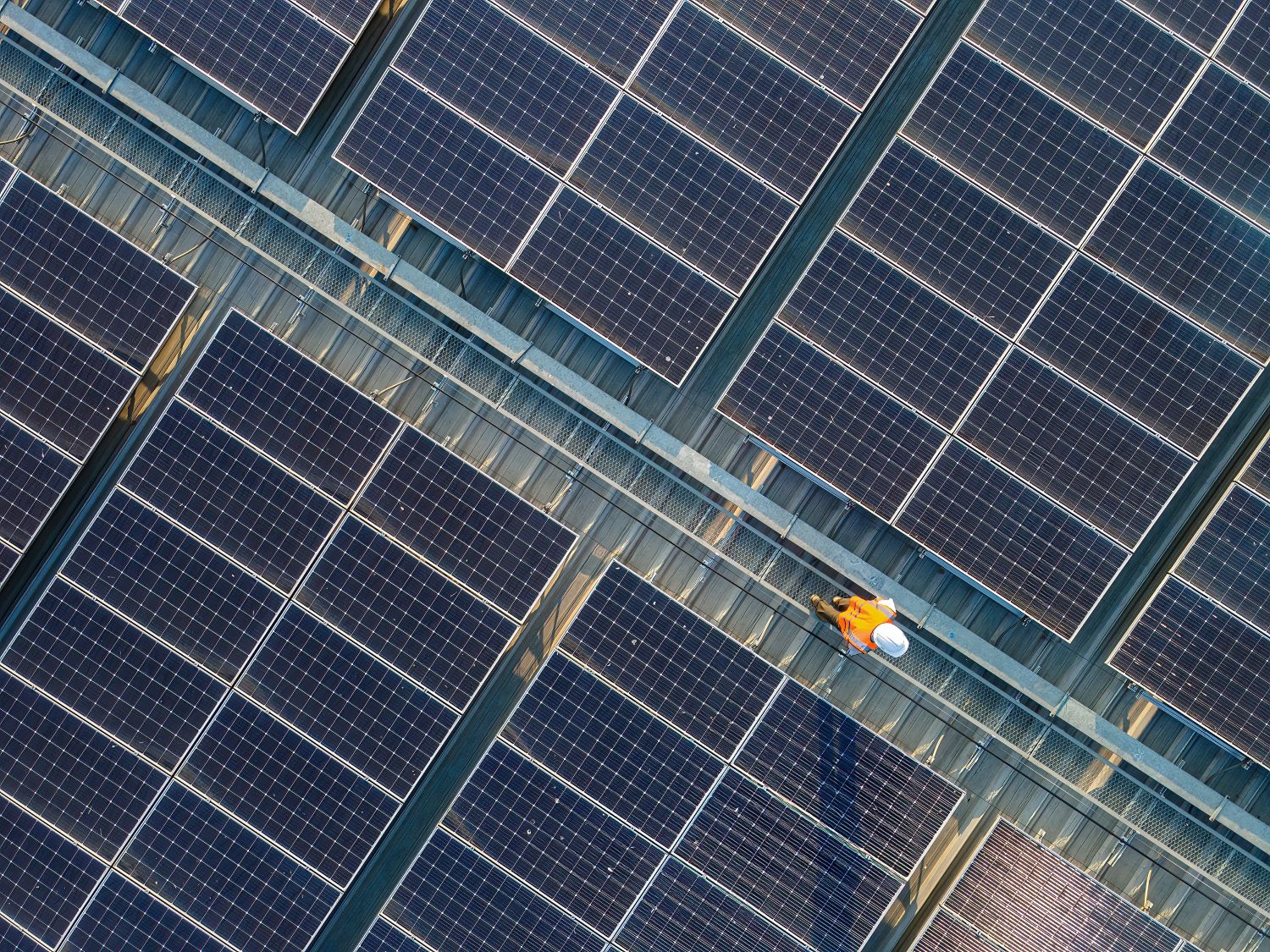An engineer working on a solar panel
