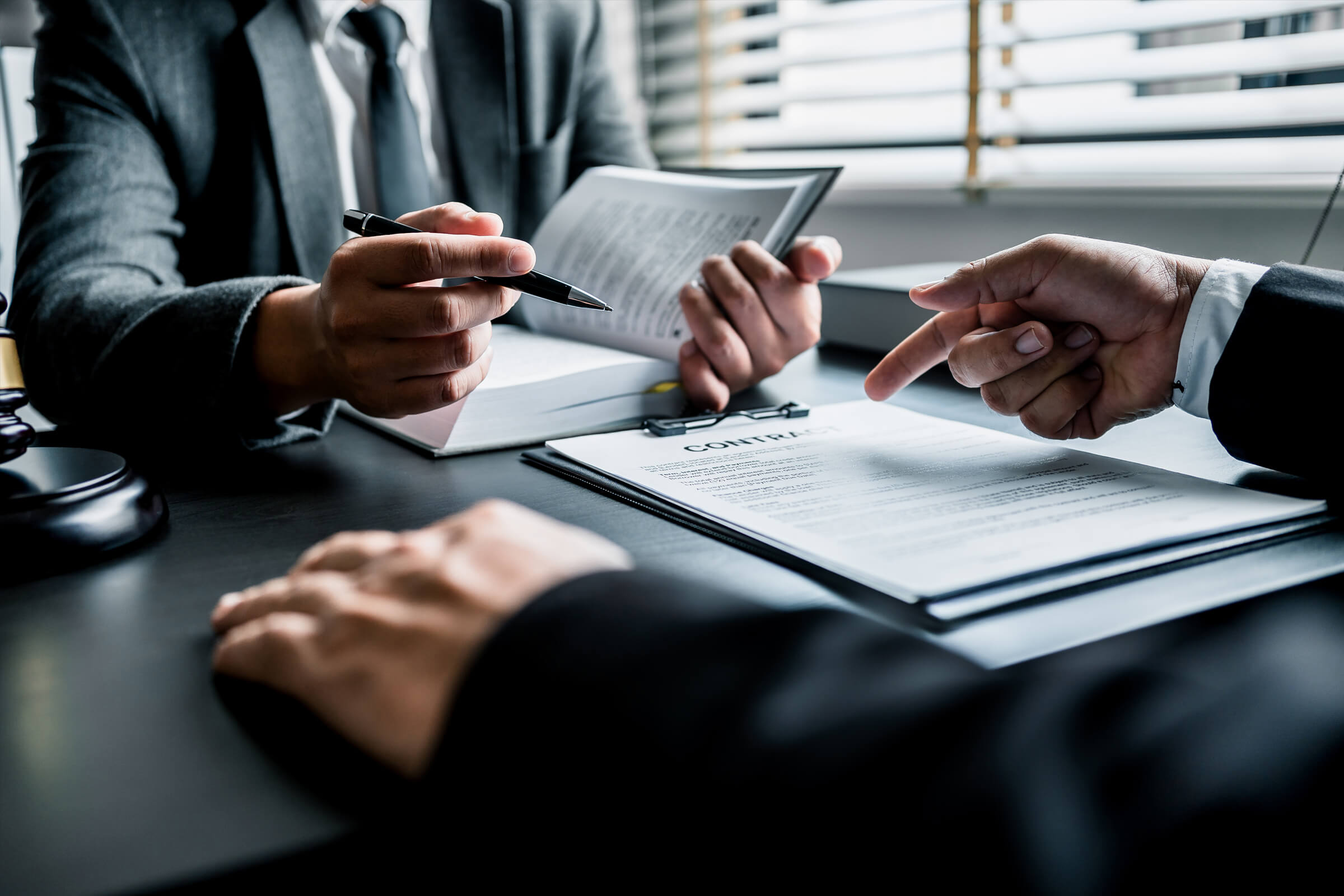 Two people negotiating a contract